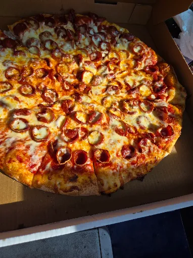 Buscemi's round pepperoni pizza in the box
