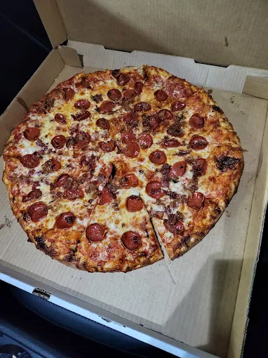 Bacon and pepperoni pizza slices from Buscemi's