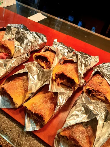 Fresh baked Buscemi's calzones wrapped in foil